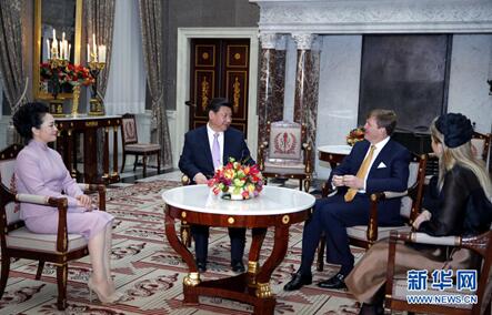 2014年3月22日，国家主席习近平在阿姆斯特丹会见荷兰国王威廉－亚历山大。新华社记者鞠鹏摄